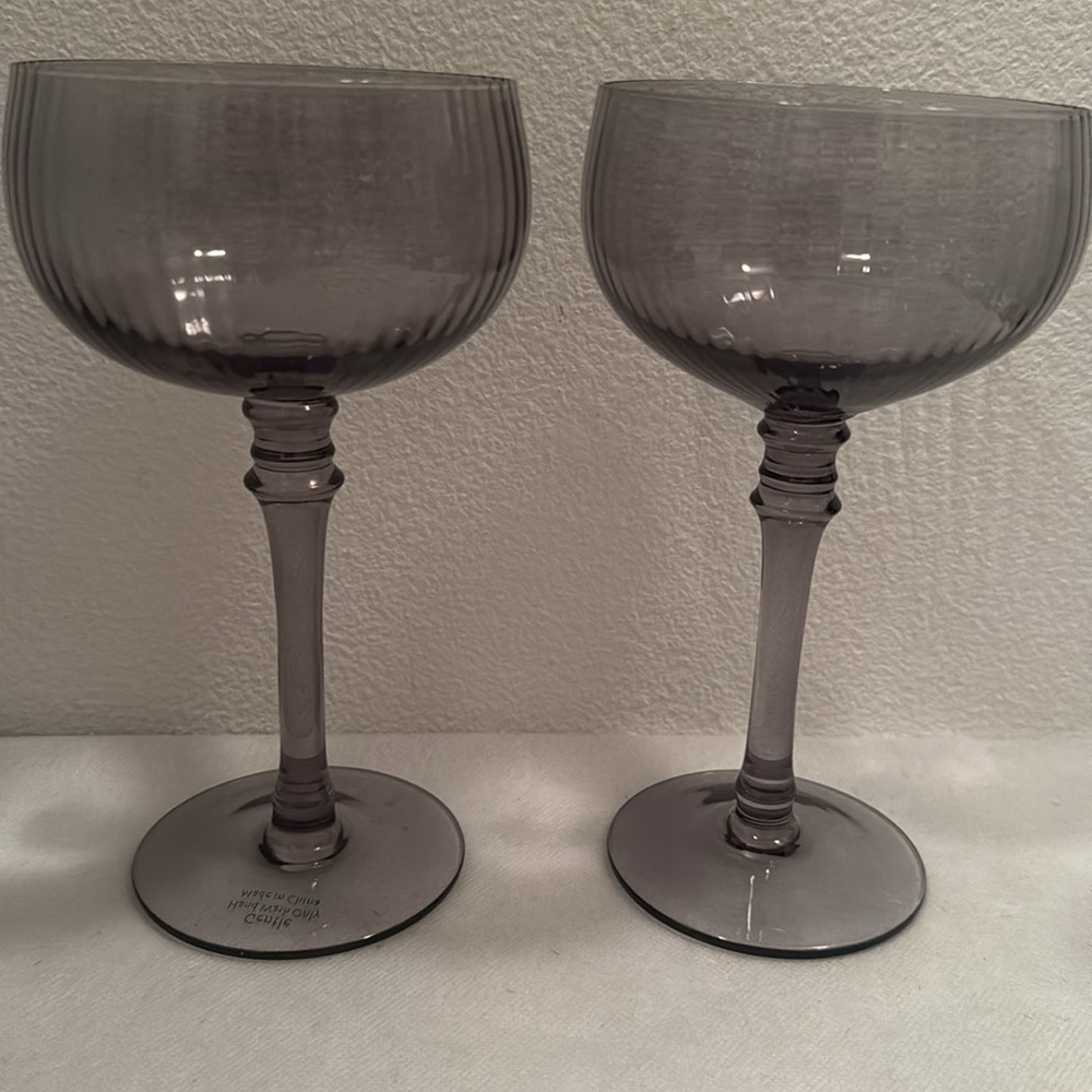 2 Smokey Grey cocktail glasses, or champagne glasses.